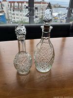 Both decanters side by side showing overall shapes and stoppers in place