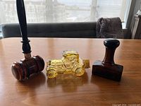 Three novelty glass cologne bottles: gavel, car, stamp
