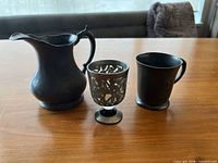 Front view of all three pewter items