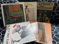 Group shot showing all five album covers