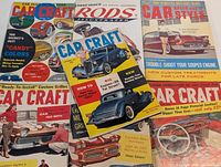 Six vintage automotive magazines spread out