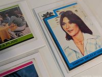 Cards #93 and #250 in sleeves showing borders and captions