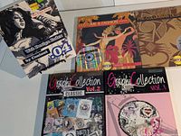All five books laid out showing covers and discs