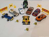 Group shot of eight vehicles with traffic accessories arranged in semicircle