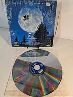 Front view of shrink-wrapped sleeve and one LaserDisc displayed