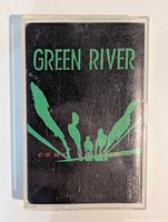 Front view of cassette in case showing album art