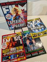 All four magazines laid out: Total Film (vertical), SFX (upper right), Empire (lower left), second Total Film (lower right)