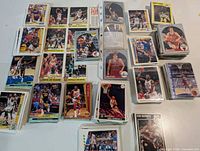 Top view of assorted basketball trading cards spread and stacked