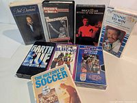 Group shot of all eight VHS tapes upright