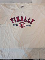 Full front view of T-shirt laid flat showing overall design