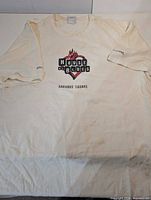 Full view of off-white House of Blues Harvard Square T-shirt front showing overall condition and staining
