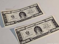 Fronts of both novelty bills showing Statue of Liberty design