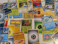 Overview of scattered Pokémon and Energy cards