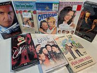 Eight sealed VHS tapes arranged for overview
