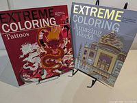 Both coloring books on stands showing front covers
