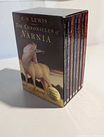 Front and spine view of slipcased set with movie tie-in sticker visible