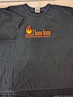 Full view of front of black Fruit of the Loom T-shirt
