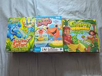 Front view of three boxed children’s games