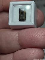 Front view of the octagon cut tourmaline in display case