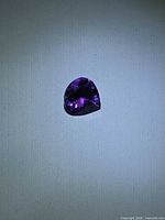 Pear-cut deep purple amethyst front view