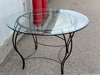 Full view of glass top metal table