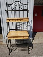 Full view of metal and wood bakers rack front