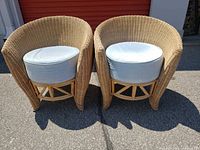 Front view of both wicker chairs with cushions