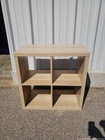 Front view showing four open cubbies