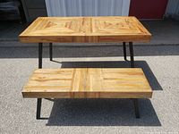 Front view of table and bench showing overall design and metal legs