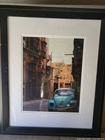 Front view of framed photograph showing VW Beetle image, mat, and frame