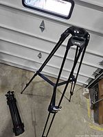 Both Cartoni tripod legs, one expanded, one collapsed