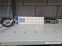 Korg nanoPAD controller, M-Audio Fast Track Pro interface, USB cable on shelf
