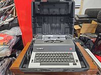 Typewriter inside open carrying case