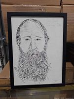Full view of the framed ink portrait drawing