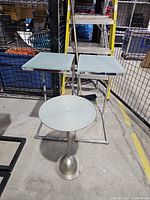 Three tables grouped: two square, one round