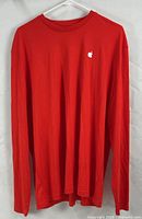 Front view of red long-sleeve Apple logo T-shirt