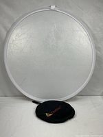 Round 32" reflector disc with pouch shown below