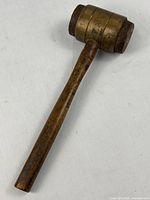 Full view of mallet showing handle and brass-clad head