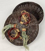 Full basket with lid removed showing woven construction and adornments