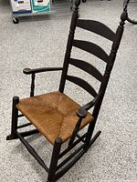 Full view of vintage ladder-back rocking chair