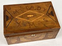 Top view showing inlaid "MY LADY XMAS" inscription and diamond motif