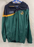 Full front view of windbreaker showing colour blocking and patches
