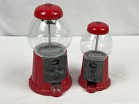 Both gumball machines front view showing relative size