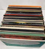 Box containing spine view of stacked vinyl LPs