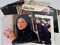Stack of LPs showing several covers including Barbra Streisand, Edith Piaf, Mary Hopkin, Nana Mouskouri