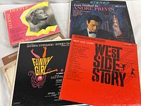 Stack of LPs showing Lucienne Delyle, Love Walked In and others