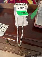 Full view of sterling silver curb chain necklace in box