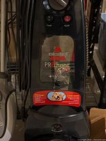 Front view showing Bissell logo, ProHeat 2X branding, Microban label