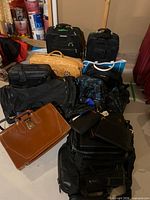 Group shot of all luggage, briefcases, bags stacked together