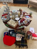 Full view of assorted Christmas decorations on and under round table